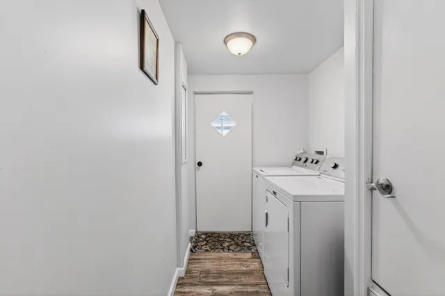 a bathroom with a sink and mirror with toilet