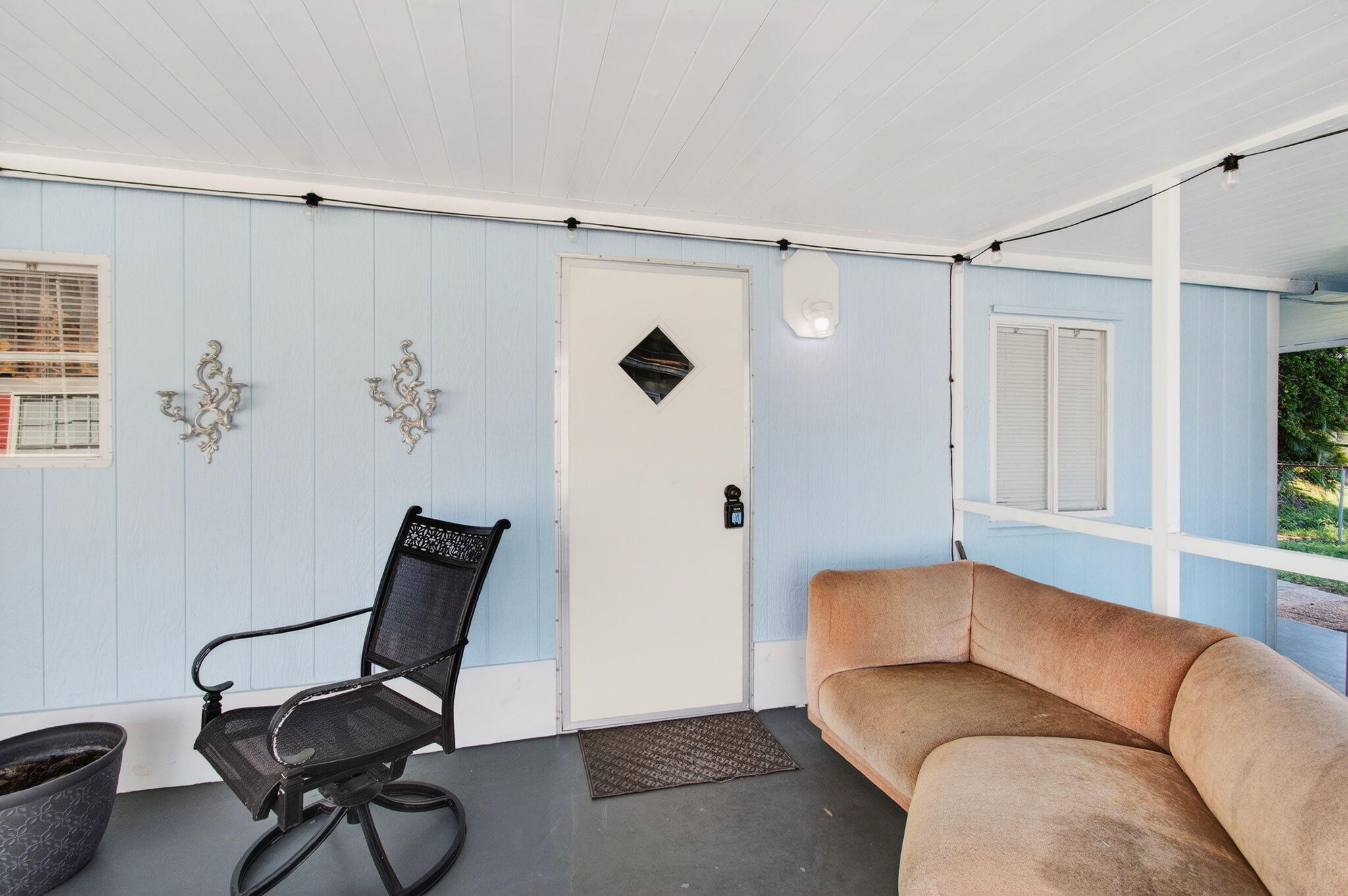 22849 Tradewind Road Boca Raton, FL 33428 - Photo 51 of 60 a living room with furniture and a window