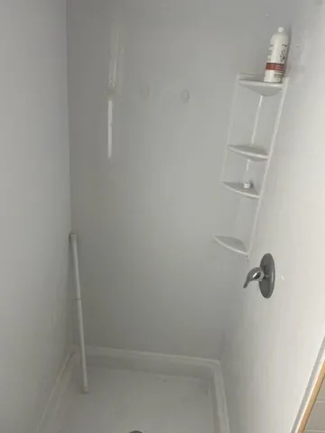 a view of a room with racks on the wall