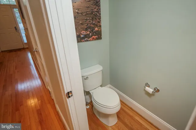 a white toilet sitting next to a sink