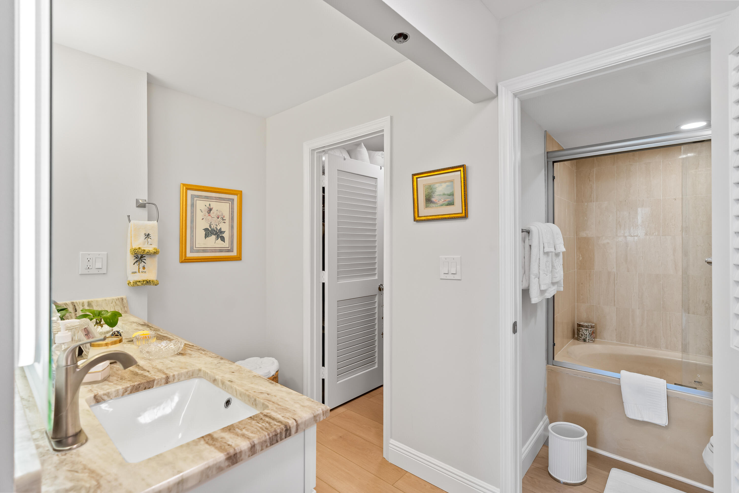 23200 Camino Del Mar, Unit 603 Boca Raton, FL 33433 - Photo 20 of 43 a bedroom with a bed and wooden floor