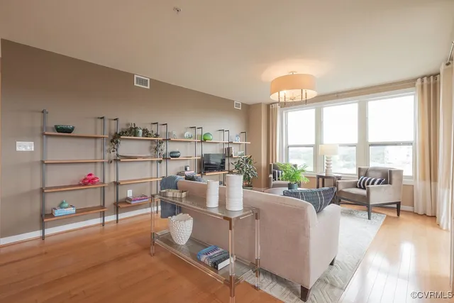 a living room with furniture and a large window