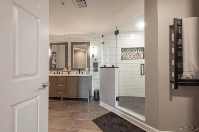 a bathroom with a shower and a sink