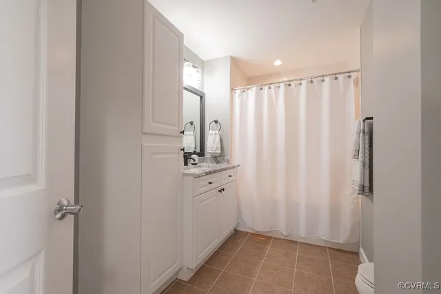 a bathroom with a sink a mirror and a shower