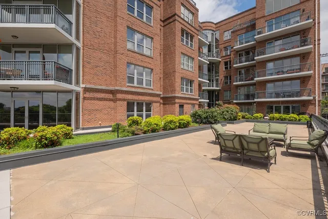 a view of a balcony with two chairs and a table