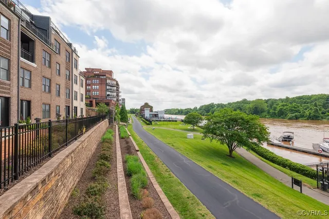 a view of house with outdoor space and lake view