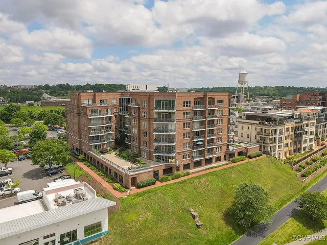 an aerial view of a city with lake view