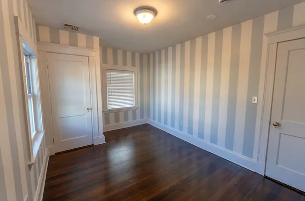 a view of a livingroom with wooden floor