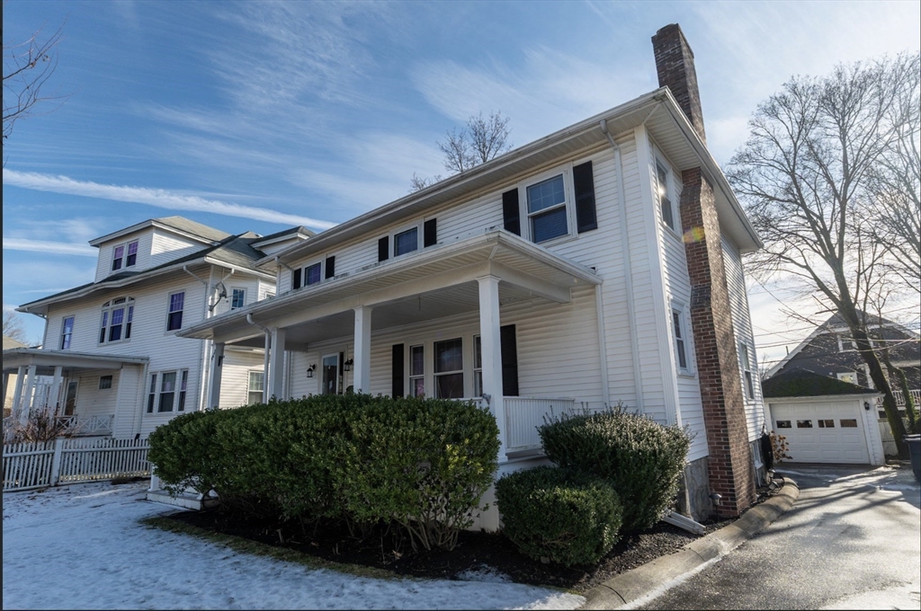 1000 South Street Boston, MA 02131 - Photo 2 of 22 a front view of a house with a garden