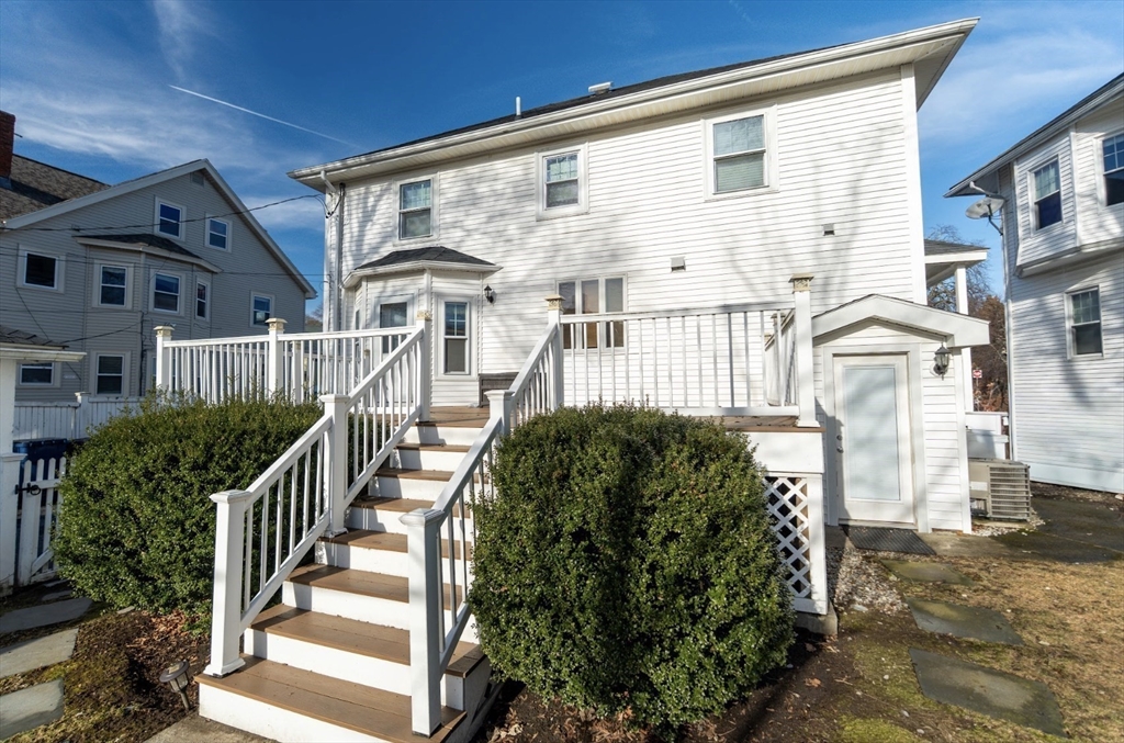 1000 South Street Boston, MA 02131 - Photo 3 of 22 a front view of a house with a yard
