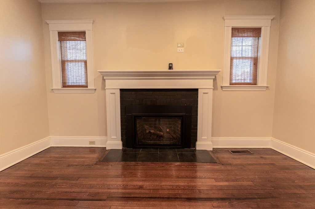 1000 South Street Boston, MA 02131 - Photo 6 of 22 a living room with a fireplace