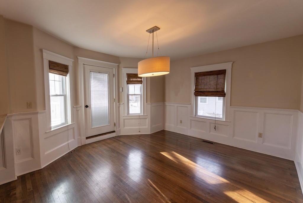 1000 South Street Boston, MA 02131 - Photo 8 of 22 a view of an empty room with wooden floor and a window