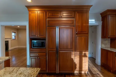 a kitchen with cabinets and stainless steel appliances