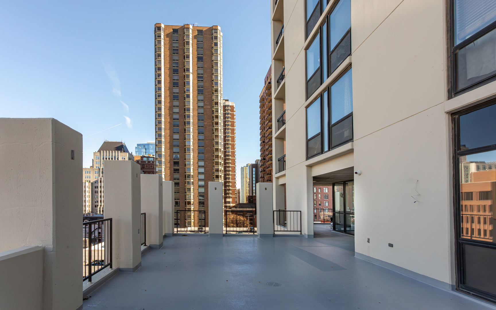 1122 North Clark Street, Unit 1808 Chicago, IL 60610 - Photo 25 of 31 a view of a building with floor to ceiling windows