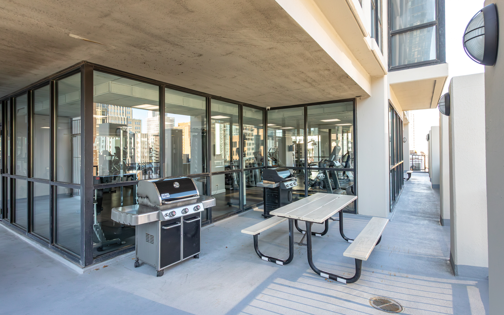 1122 North Clark Street, Unit 1808 Chicago, IL 60610 - Photo 28 of 31 a living room with furniture and a floor to ceiling window