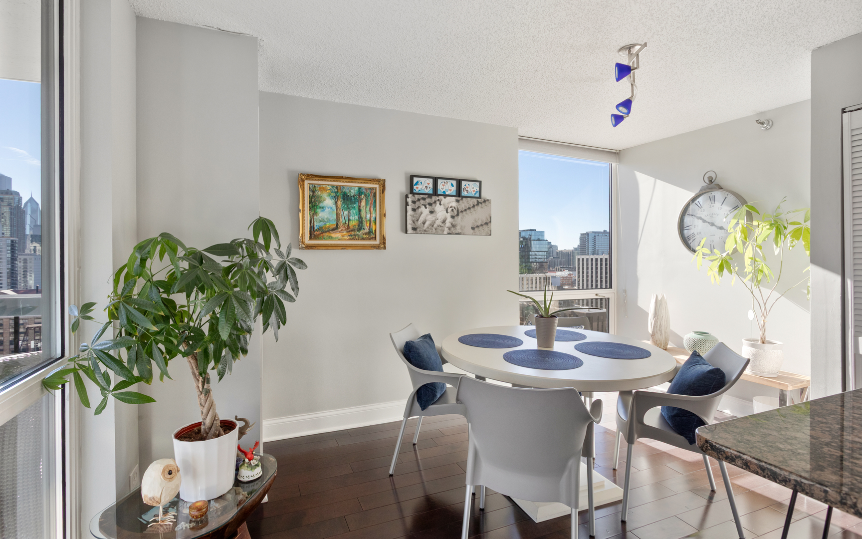 1122 North Clark Street, Unit 1808 Chicago, IL 60610 - Photo 6 of 31 a view of a dining room with furniture and wooden floor