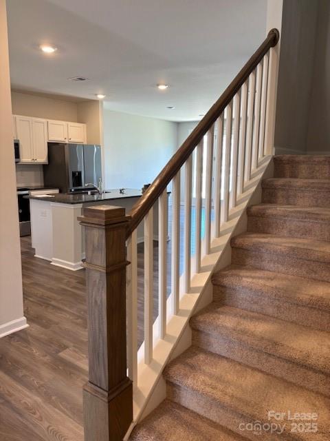 7136 Maple Run Circle Charlotte, NC 28215 - Photo 22 of 39 a view of entryway and kitchen with wooden floor