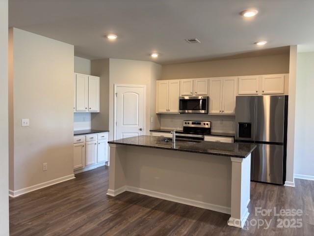 7136 Maple Run Circle Charlotte, NC 28215 - Photo 23 of 39 a kitchen with stainless steel appliances granite countertop a stove a sink and a refrigerator