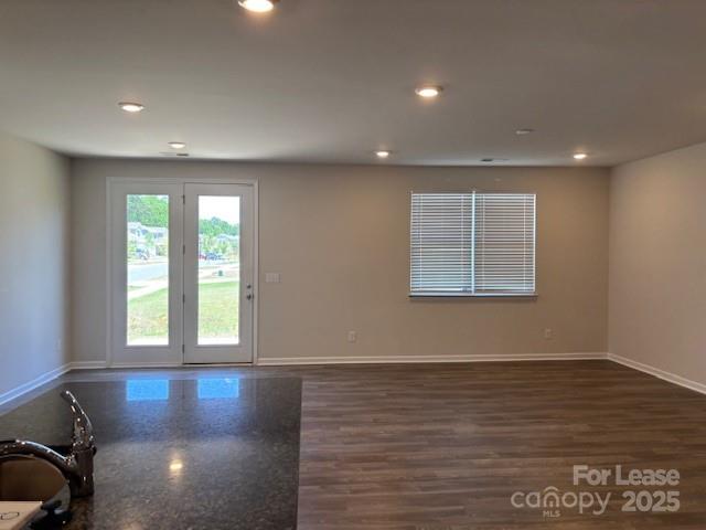 7136 Maple Run Circle Charlotte, NC 28215 - Photo 24 of 39 an empty room with wooden floor and windows