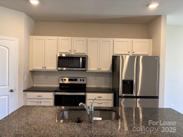 7136 Maple Run Circle Charlotte, NC 28215 - Photo 26 of 39 a kitchen with stainless steel appliances granite countertop a refrigerator stove and microwave