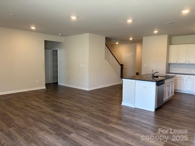 7136 Maple Run Circle Charlotte, NC 28215 - Photo 29 of 39 a view of kitchen with cabinets stainless steel appliances and wooden floor