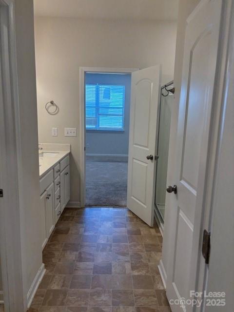 7136 Maple Run Circle Charlotte, NC 28215 - Photo 10 of 39 a bathroom with a granite countertop sink a mirror and a shower