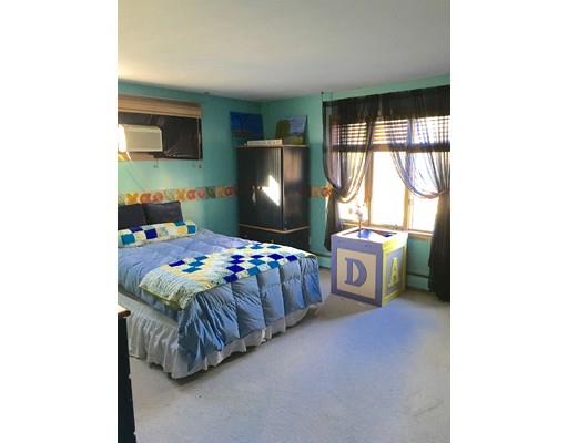 25 Auburndale Road Marblehead, MA 01945 - Photo 8 of 9 a bedroom with a bed and a tv