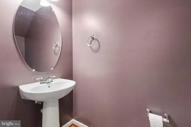 a bathroom with a sink and mirror