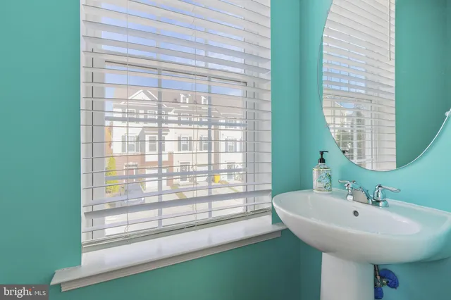 a bathroom with a sink and a large mirror