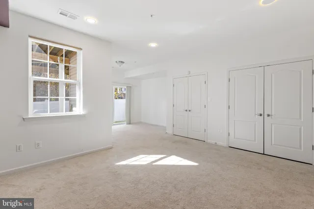 a view of empty room with windows