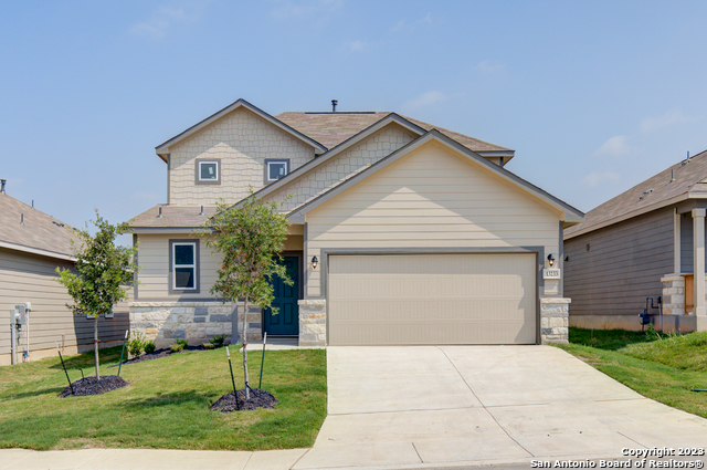 13233 Hagerd Loop St. Hedwig, TX 78152 - Photo 1 of 1 a front view of a house with a yard and garage
