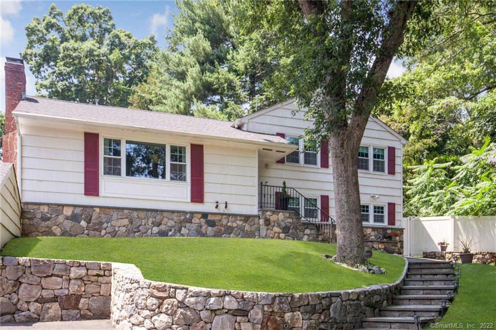 131 Compo Road North Westport, CT 06880 - Photo 1 of 1 a front view of a house with garden