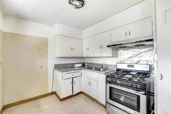 a kitchen with a stove and a sink
