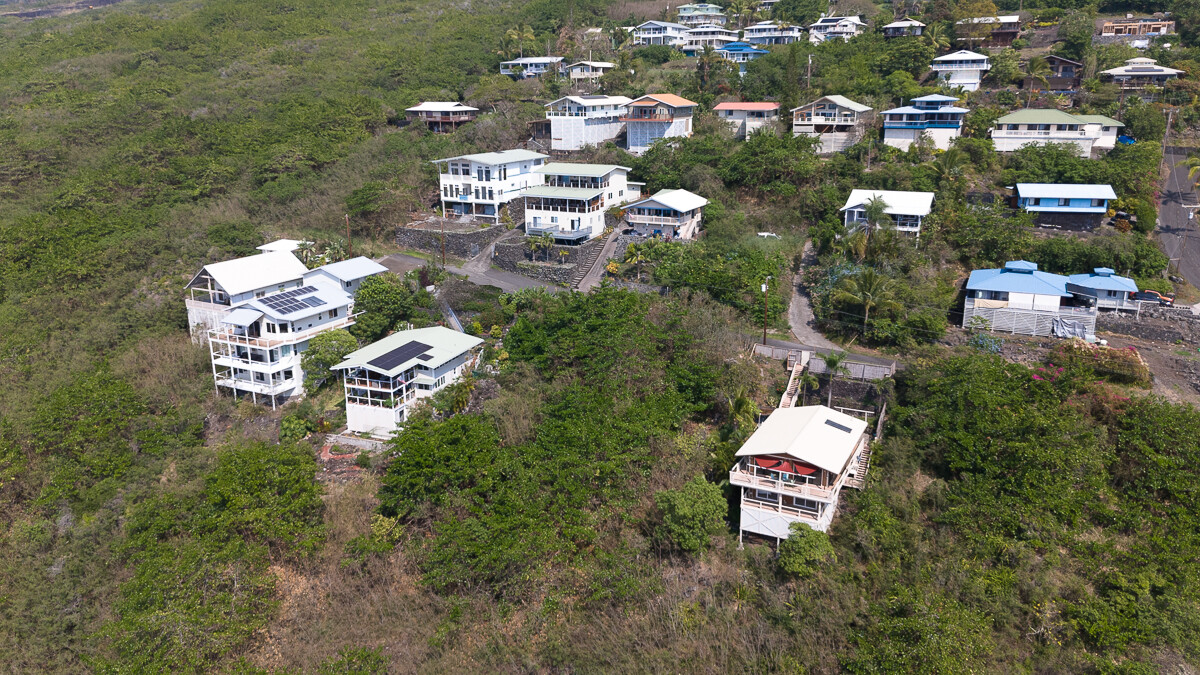 143 Ea Road Captain Cook, HI 96704 - Photo 10 of 15 an aerial view of a house with a yard and lake view