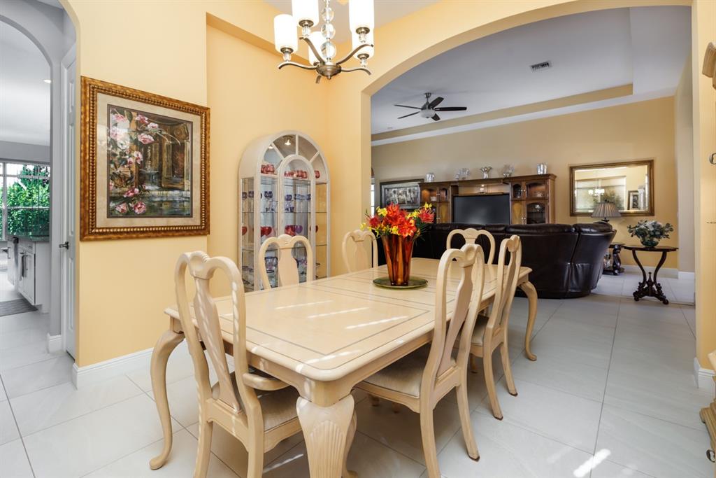 21864 Southwest Tivolo Way Port St. Lucie, FL 34986 - Photo 14 of 40 a view of a dining room with furniture