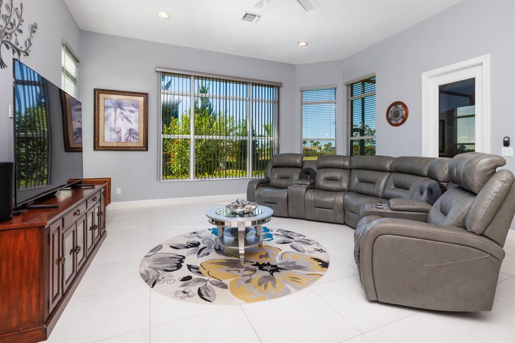 21864 Southwest Tivolo Way Port St. Lucie, FL 34986 - Photo 21 of 40 a living room with furniture and a large window