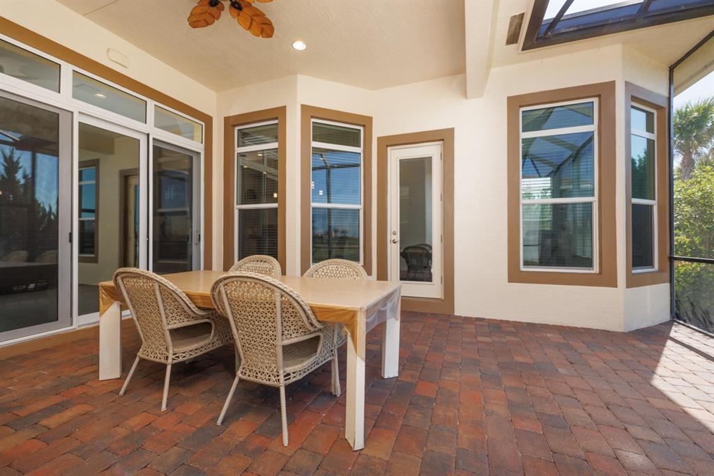 21864 Southwest Tivolo Way Port St. Lucie, FL 34986 - Photo 30 of 40 a view of a house with a porch and furniture