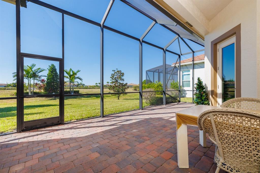 21864 Southwest Tivolo Way Port St. Lucie, FL 34986 - Photo 31 of 40 a view of a house with backyard and porch