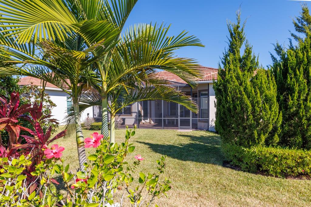 21864 Southwest Tivolo Way Port St. Lucie, FL 34986 - Photo 32 of 40 a view of a backyard with plants