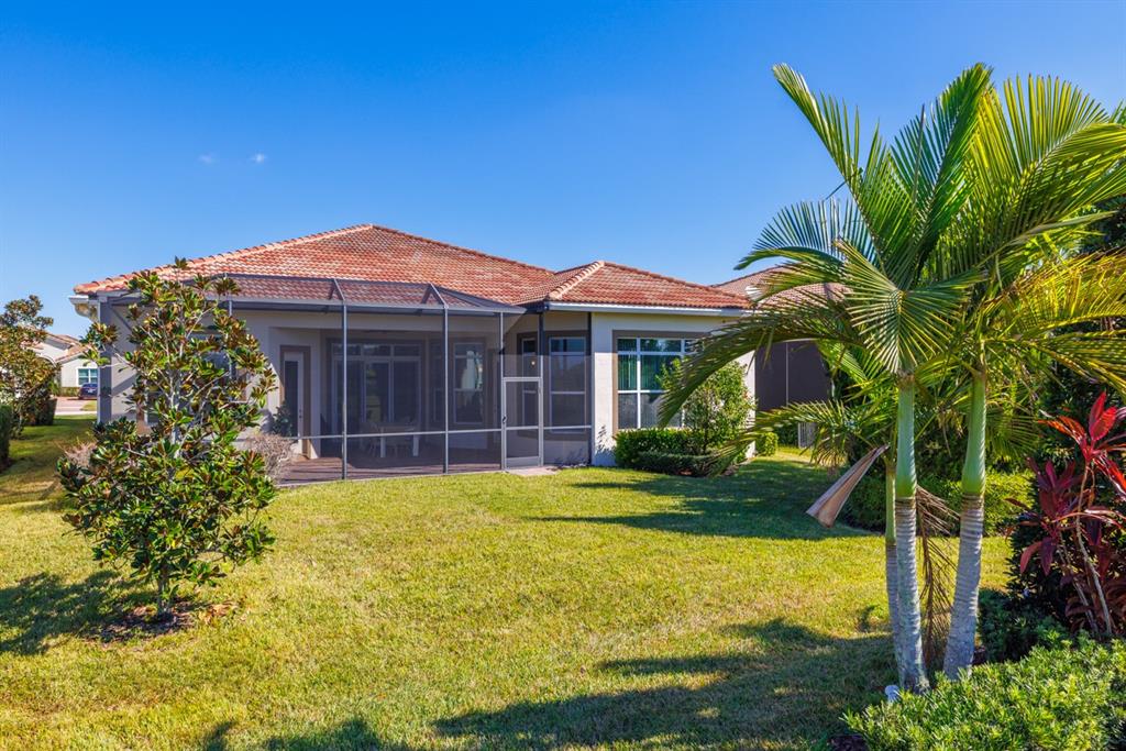 21864 Southwest Tivolo Way Port St. Lucie, FL 34986 - Photo 33 of 40 a view of a house with a garden