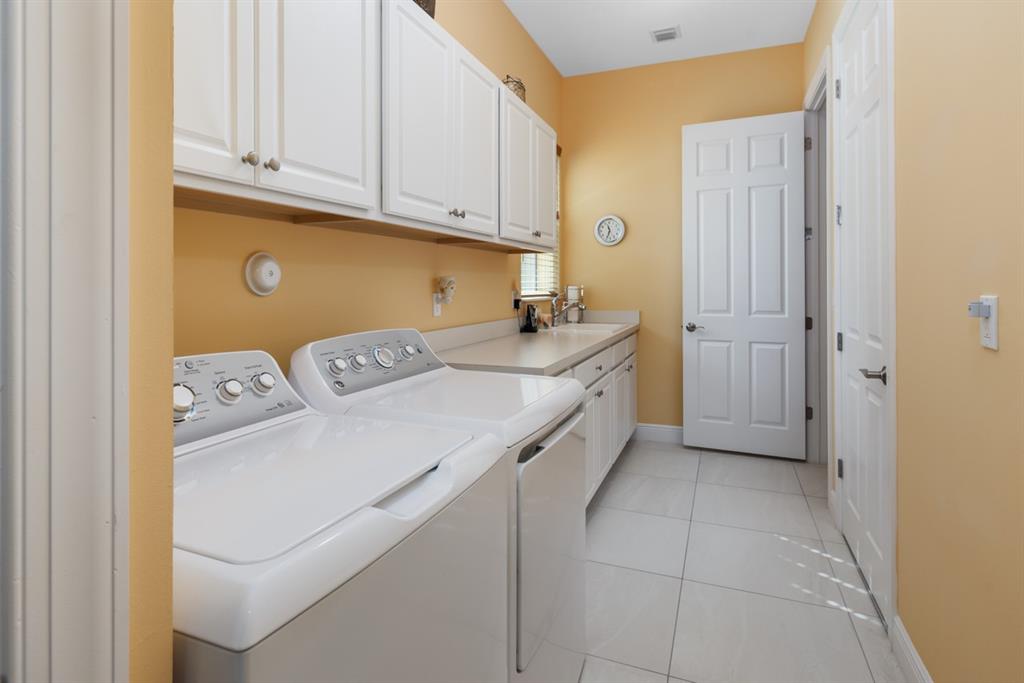21864 Southwest Tivolo Way Port St. Lucie, FL 34986 - Photo 35 of 40 a utility room with dryer and washer