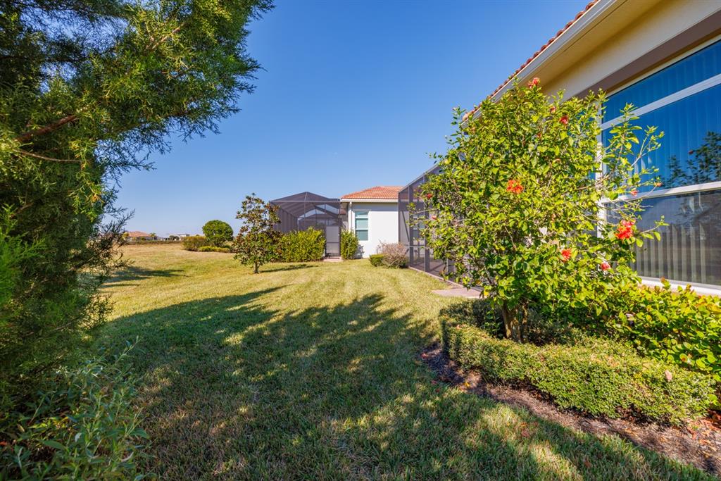 21864 Southwest Tivolo Way Port St. Lucie, FL 34986 - Photo 39 of 40 a view of a yard with plants and large trees
