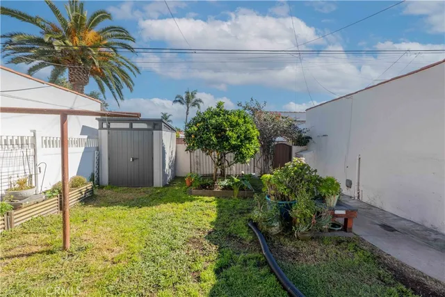 a backyard of a house with palm trees