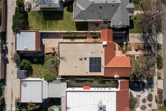 an aerial view of house with yard