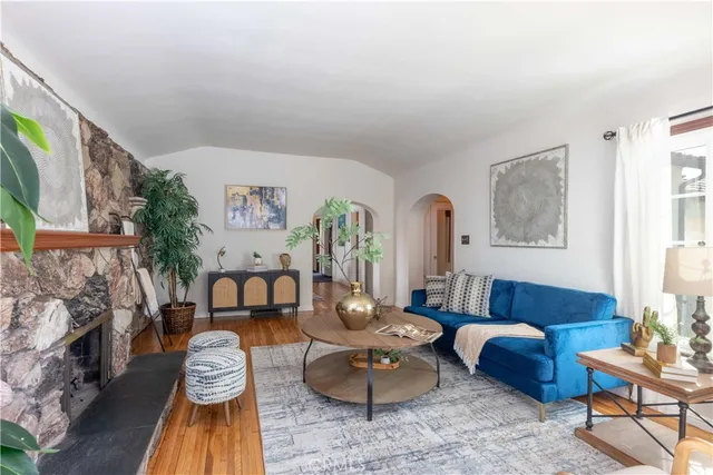a living room with furniture and a fireplace