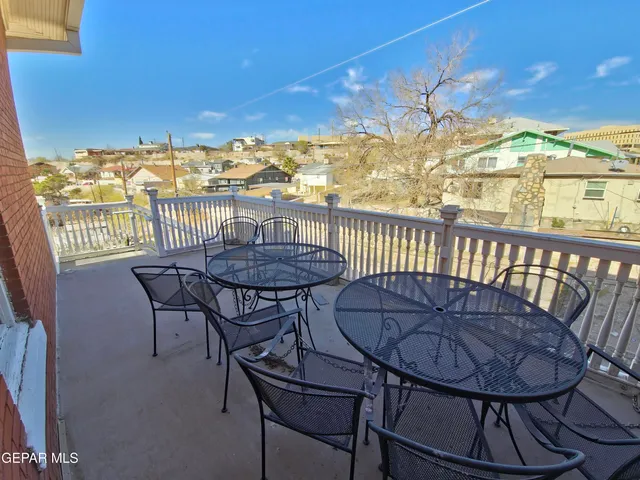a brick building with a bench in front of it
