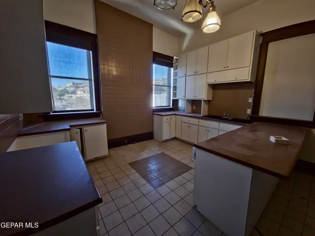 a view of a hallway with a chandelier