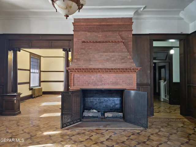 a view of hall way with furniture