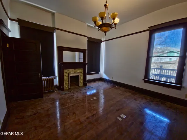 a view of an entryway door with a chandelier