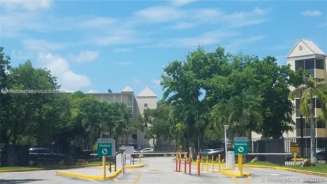 a view of a swimming pool with a patio and a yard